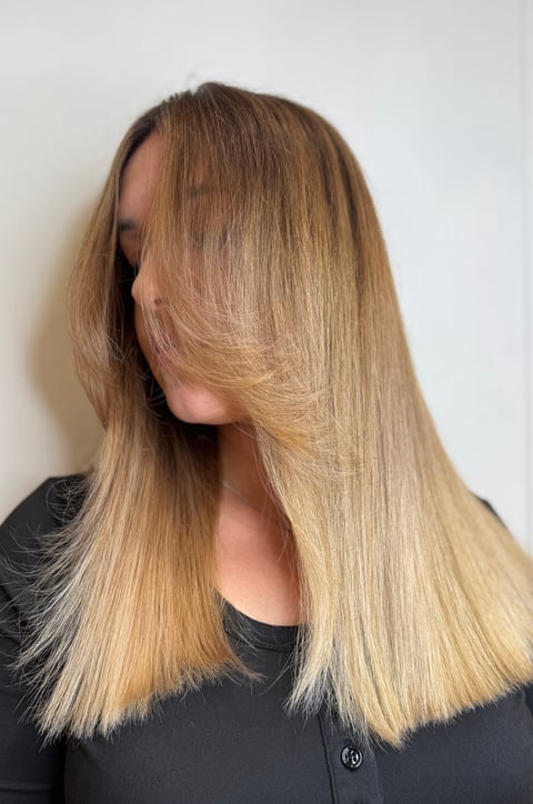 Woman with long, straight honey-blonde hair